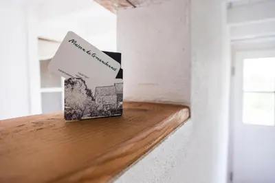 a box sitting on top of a wooden shelf in a room at Bellevue Maison de Greunebennet in Plombières