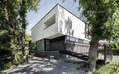 a modern house with a black and white facade at MAIO B&B en Dinner in Zonhoven