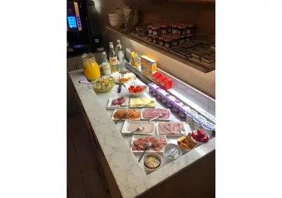 a buffet line with many different types of food at Boutique Hotel Caelus VII in Tongeren