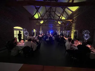 a group of people sitting at tables in a room at Hotel Oude Eycke in Maaseik