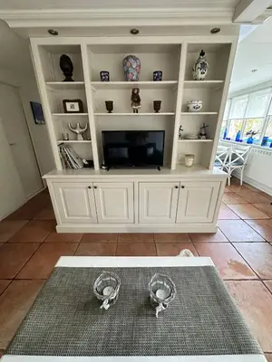 a large white entertainment center with a flat screen tv at Holiday Home 'Beautifull Water' in Lanaken