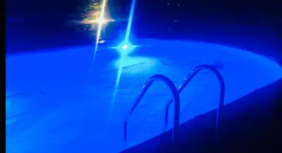 a blue light is shining on a surfboard at Holiday Home 'Beautifull Water' in Lanaken