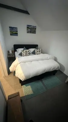 a bedroom with a bed in a room at Bed & Bets! in Geetbets