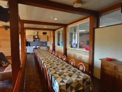 a dining room with a checkered table and chairs at Trooz Villa with Pool & Sauna in Trooz