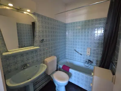 a bathroom with a sink and a toilet and a tub at Trooz Villa with Pool & Sauna in Trooz