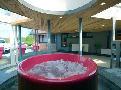a red tub with snow inside of a house at Trooz Villa with Pool & Sauna in Trooz