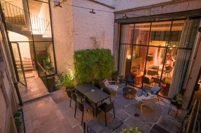 an overhead view of a patio with tables and chairs at Hotel Neuvice in Liège