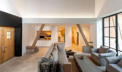 a living room with a couch and two chairs at Winning De Zwaen in Hasselt