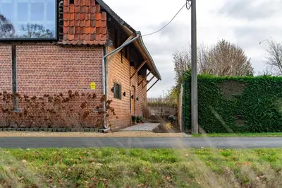 a brick building on the side of a street at Winning De Zwaen in Hasselt