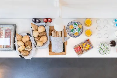 an overhead view of breakfast foods on a counter at B&B Bed and Beyond in Oudsbergen