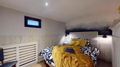 a bedroom with a bed with a stuffed animal on it at SintPieter17 Lo-Ghis vakantiewoning in Voeren