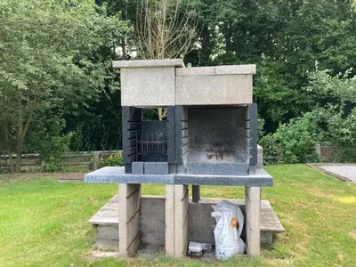a outdoor oven with a chicken inside of it at Joff in Budingen