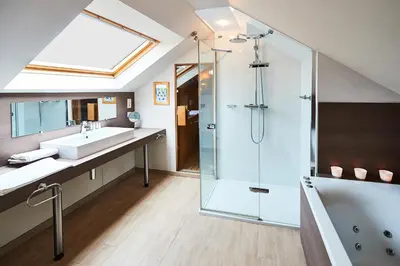 a bathroom with a sink and a shower at Wellness B&B De Zevenslaper in Geetbets