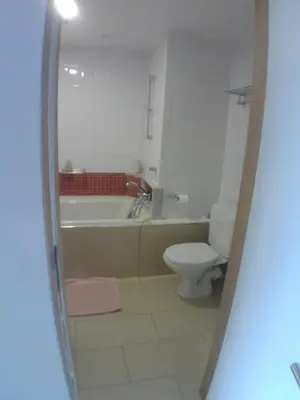 a bathroom with a tub and a toilet and a sink at Liège centre 13 Quai Godefroid Kurth POUR 2 PERS à 25 min gare Guillemins in Liège