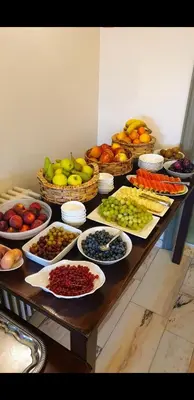 a table filled with different types of fruits and vegetables at Belrom Hotel in Sint-Truiden