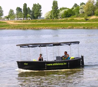 two people on a boat in the water at Botel Ophoven in Kinrooi