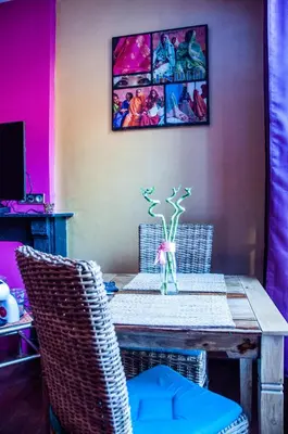 a dining room with a table and two chairs at Vip room 209 in Trooz