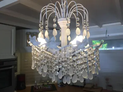 a chandelier hanging from a ceiling in a kitchen at Chalet Sint Barbara in Zutendaal