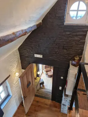 an overhead view of an attic room with a window at Een vleugje wellness in de Voerstreek - Bed & Brocante Onder de Poort in Voeren