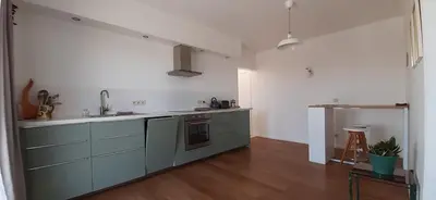 a kitchen with a sink and a counter top at De Notelaar in Kortessem