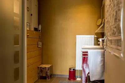 a small kitchen with a counter and a refrigerator at StroEnzo - RUIME LOFT - 5P - 2SLPK - DAKTERRAS - LAADPAAL - 10MIN Maastricht in Riemst