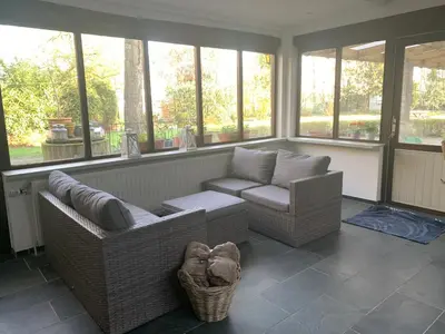 a living room with two chairs and a couch at B&B Dageraad in Bocholt