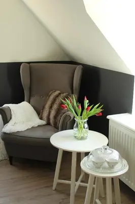 a living room with a couch and a table at B&B Dageraad in Bocholt