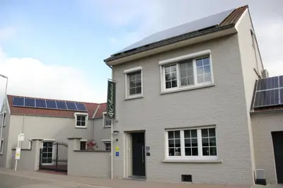 a building with solar panels on the roof at AMADIS in Kesselt
