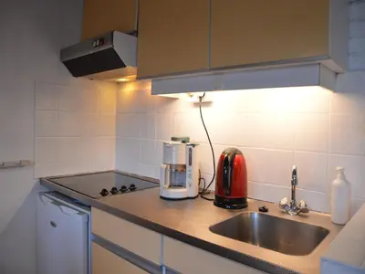 a kitchen with a sink and a counter top at Holiday Home in Gemmenich with Forest Views in Ten Eiken