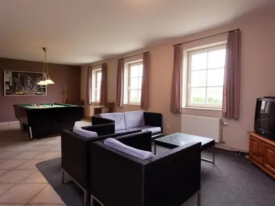 a living room with couches and a pool table at Peer Villa with Garden in Peer