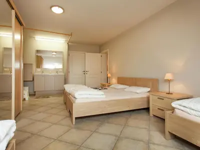 a bedroom with two beds and a mirror at Peer Villa with Garden in Peer