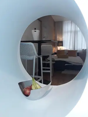 a room with a table and a bowl of fruit at Hébergement Les Heros in Liège
