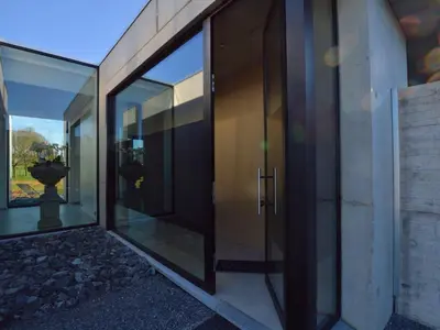 an external view of a glass door of a house at Dalhem Villa with Garden in Dalhem