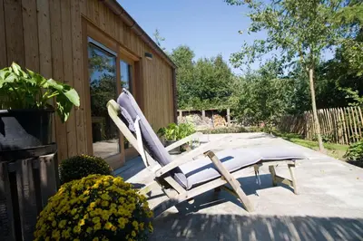 a pair of chairs sitting on a patio at De kiezel in Hasselt