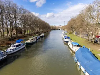a group of boats docked on a river at Modern Dalhem Villa with Views in Dalhem