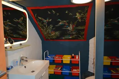a bathroom with a sink and a mirror at Julienne5 in Blégny