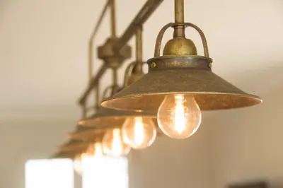 a row of lights hanging from a ceiling at 'Op de Borgt' met Finse Grill Kota in Wellen