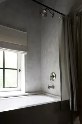 a bathroom with a shower with a sink and a window at Moka & Vanille in Heusden - Zolder