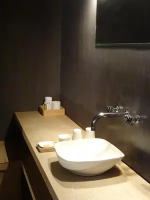 a bathroom with a white sink on a counter at Moka & Vanille in Heusden - Zolder