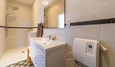 a white bathroom with a sink and a mirror at Lyves Two in Liège