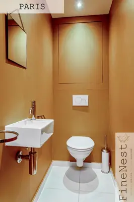 a bathroom with a sink and a toilet at Résidence de 3 appartements luxueux - 2 ch x 3 - 