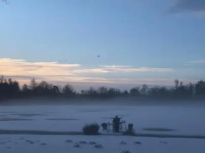 a picnic table in the middle of a frozen lake at Vakantiewoning ‘t Reigersnest in Zonhoven