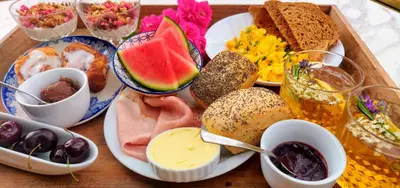 a tray filled with different types of food on a table at Wetterdelle Lodge in Heers