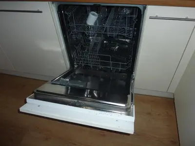 an open refrigerator with its door open on the floor at Vakantie woning De Loft in Dilsen-Stokkem