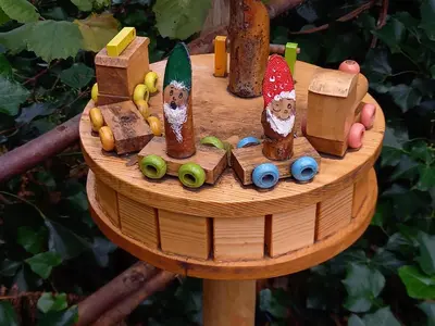 a wooden toy train on a wooden stand at CASA Victoria in Kuringen