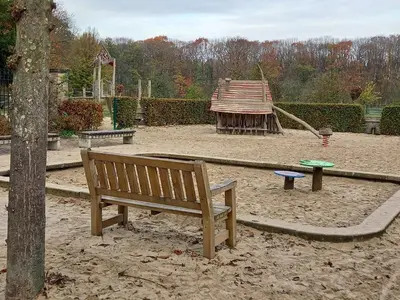 a park with a bench and a playground at CASA Victoria in Kuringen