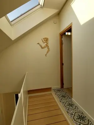 a staircase in a house with a skylight at De Lokroep in Heers