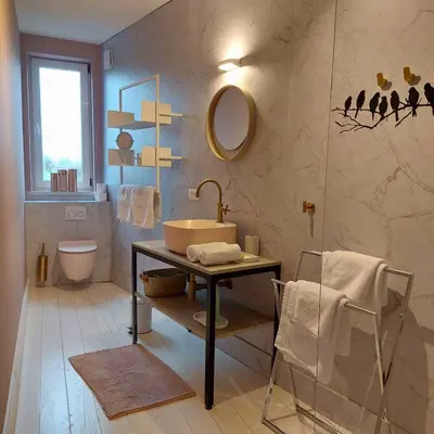 a bathroom with a sink and a toilet at Boerderaaj vakantiewoning in Bilzen