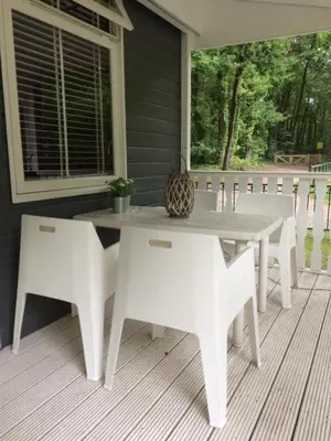a white table and chairs on a porch at Chalet Belvedere in Lanaken in Lanaken