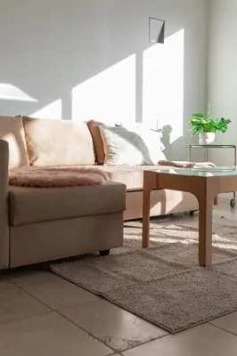 a living room with a couch and a coffee table at Esplanada Studios in Genk